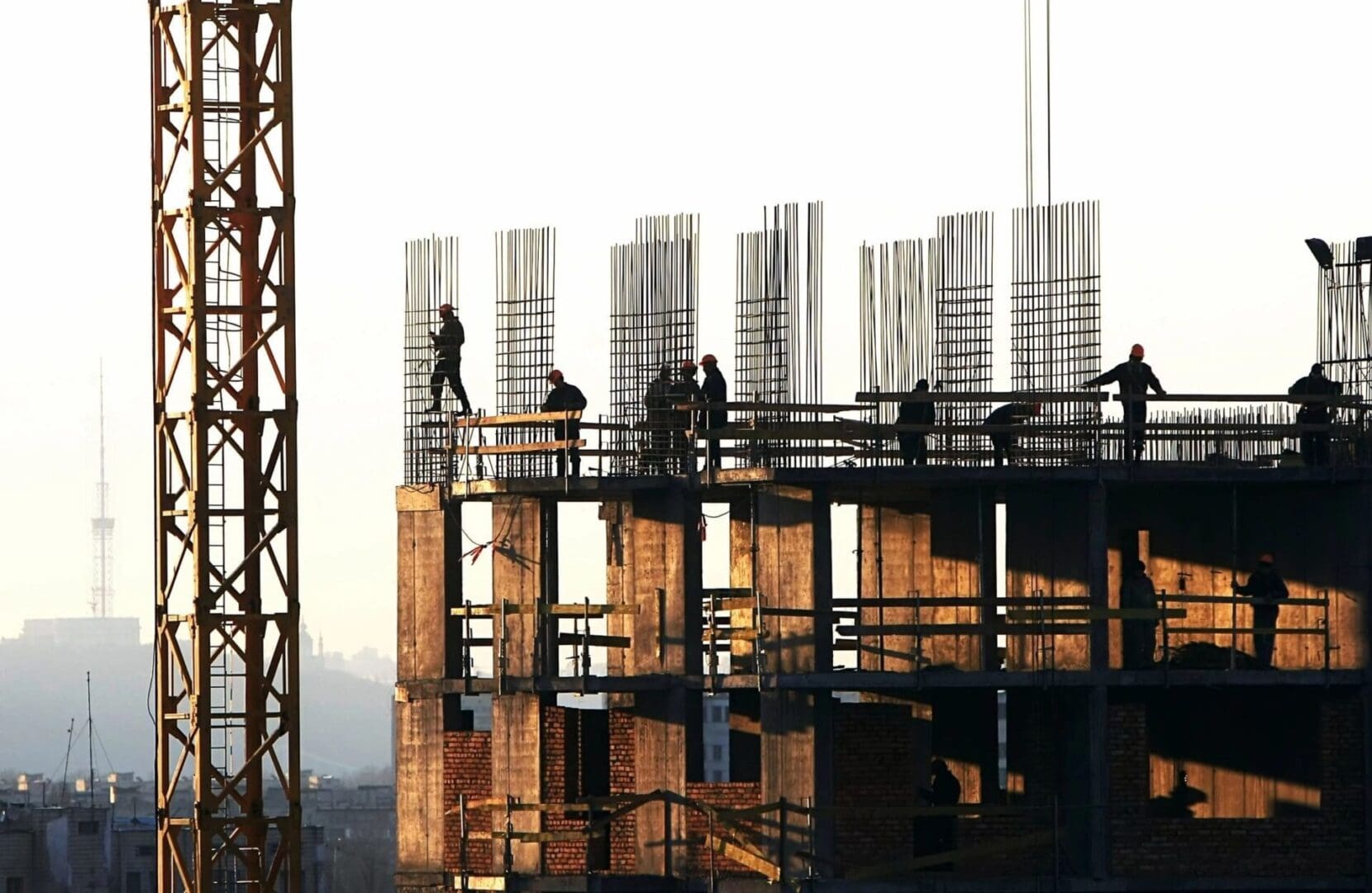 A group of people standing on top of a building.