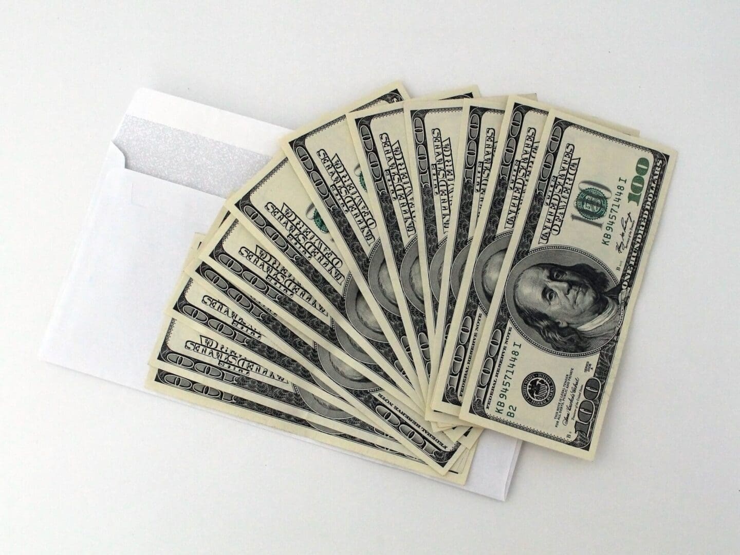 A close up of ten dollar bills in an envelope