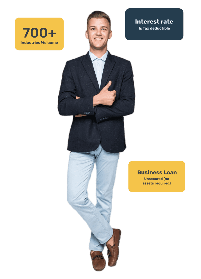 A man standing in front of a green background