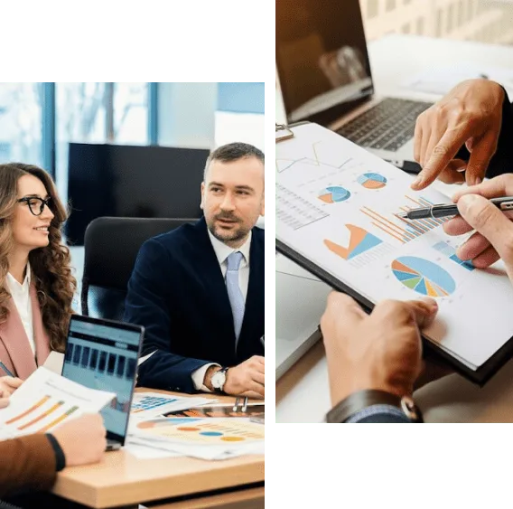 A group of people sitting at tables with papers.