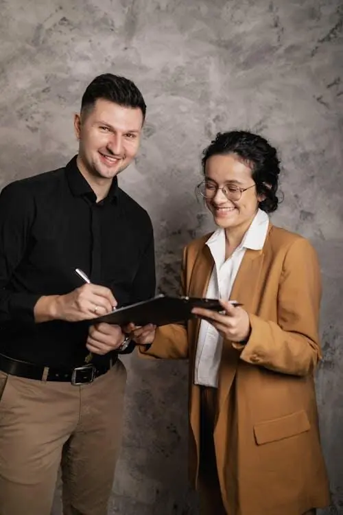 A cartoon of two people sitting at a table