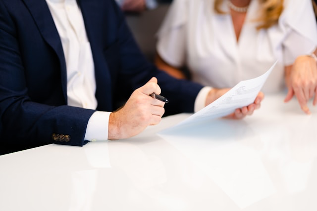 This pictures shows two people reviewing business documents