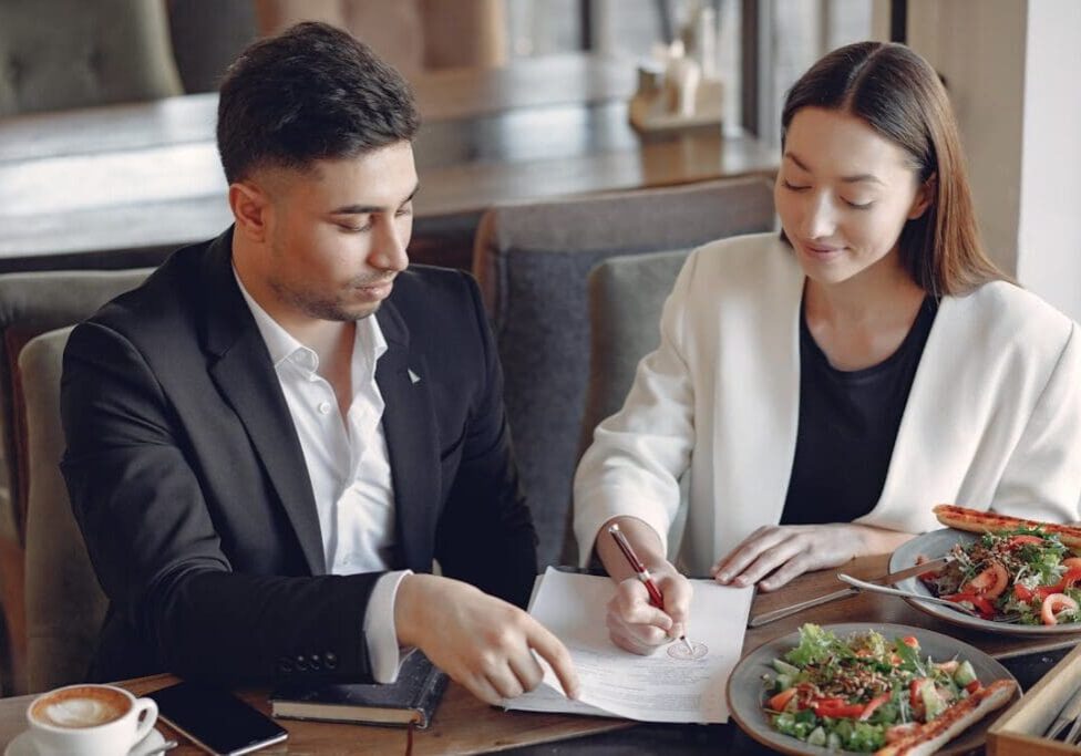 Business owner signing documents for short-term funding