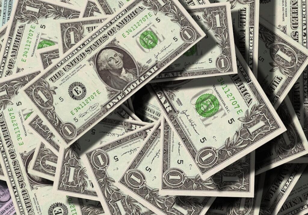 Dollar bills spread out on the table