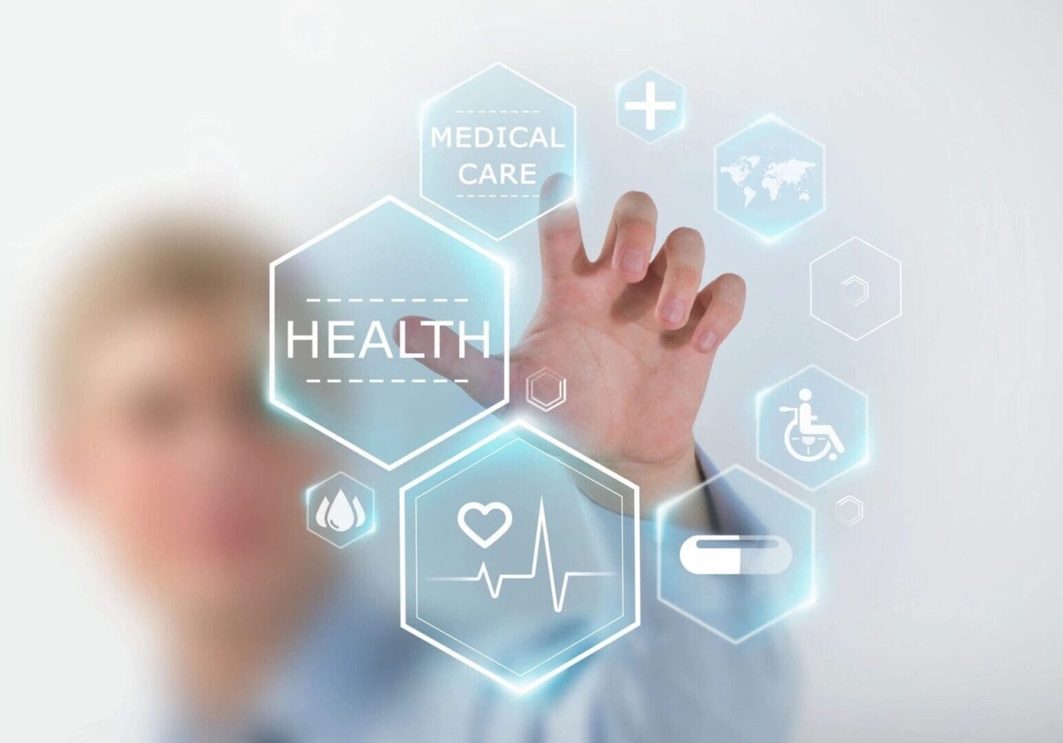 A person touching an image of medical icons.