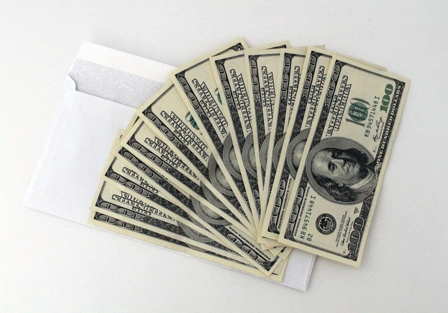 A close up of ten dollar bills in an envelope